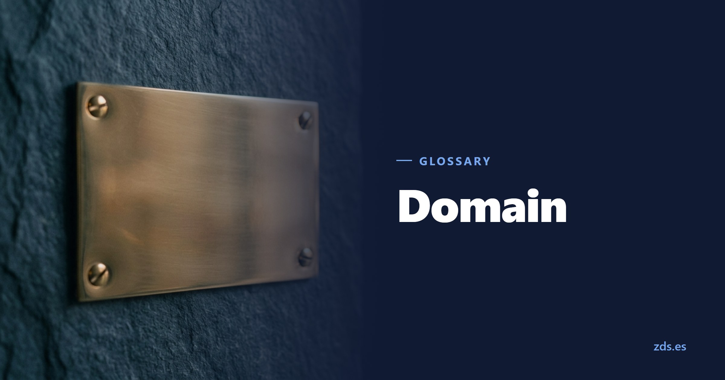 A brass nameplate on a stone wall, its engraving area blank — beside the title Domain